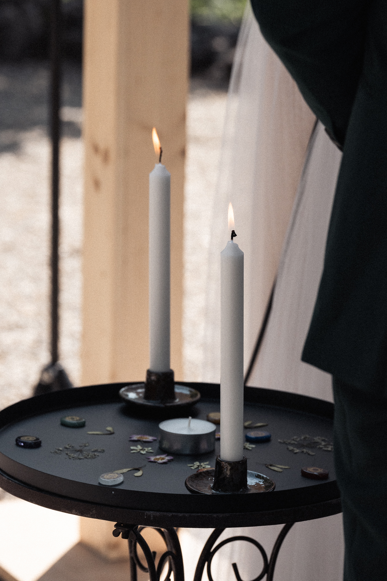 white candle beside white book